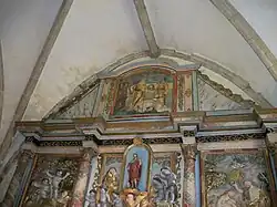 Le centre et le sommet du retable.