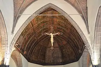 Voûte du chœur recouverte de panneaux de bois peints (1588).