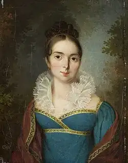Une jeune fille en robe bleue