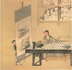 Lettré en train de lire et se faisant montrer, par son serviteur, un rouleau suspendu