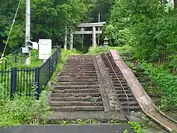 Located at the base of the sanctuary.