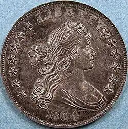 L'avers d'une pièce de monnaie représentant une femme allégorique.