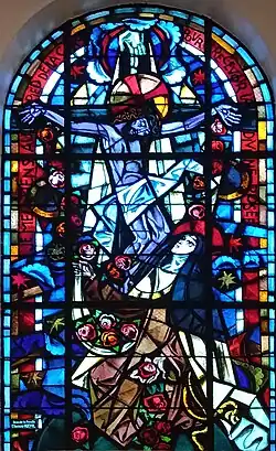 Contemplation de la Sainte face du Christ, Thérèse recueille les grâces (roses) du Crucifié. "Je me tiens au pied de la croix pour recevoir la divine rosée"