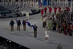 Photographie de l'entrée de la délégation des Îles Caïmans lors de la cérémonie d'ouverture.