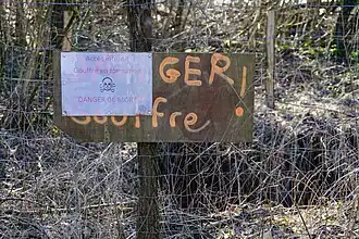 Panneau d'avertissement (puits E).