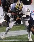 En action lors du Military Bowl 2015 avec Pittsburgh