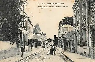 Carte postale représentant la rue Carnot depuis le carrefour Carnot — aujourd'hui place Milosz —, au tournant du XXe siècle