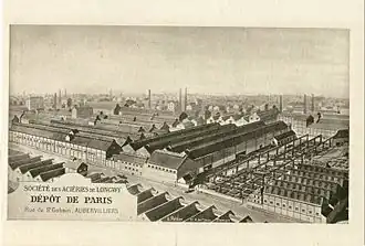 Les Aciéries de Longwy, près du canal Saint-Denis au début du XXe&nbsp;siècle.Le cliché montre l’impact de la grande industrie dans la ville.