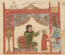 Miniature persane représentant une maison, où une femme en vert tisse au rouet au centre, tandis que son fils en rouge et son mari en bleu discutent à droite.