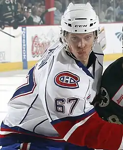 Photographie couleur d'un joueur de hockey sur glace