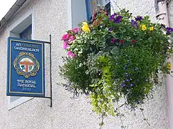 Fondée à Oban en 1891, An Comunn Gàidhealach est une institution gaëlle et gaélique, qui fait la promotion de l'enseignement, de l'apprentissage et de l'utilisation de la langue gaélique, mais aussi de l'étude de la culture, de la littérature, de l'histoire, de la musique et de arts gaëls, notamment par le biais du Royal National Mòd.