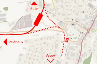 Carte représentant la gare ouverte en 2019 (rectangle plein) et l'ancienne gare (rectangle vide), avec la voie actuelle en trait plein et les anciennes voies en pointillé.