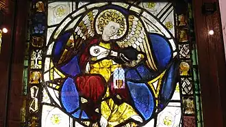 Représentation d'un joueur de guiterne, sorte de guitare, dans un médaillon individuel