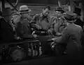 L'Ange et le Mauvais Garçon (1947), avec Pat Flaherty et Wade Crosby (chapeau melon gris) entourant John Wayne
