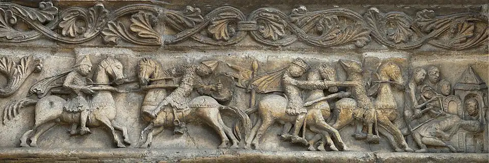 Sculpture représentant des chevaliers à cheval se donnant des coups de lance.