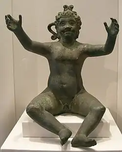 Assis les bras ouverts. California Palace of the Legion of Honor.