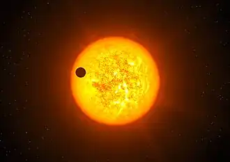 CoRoT-9 b en transit devant son étoile (vue d'artiste).