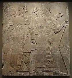 Assurnasirpal II et un génie ailé, palais nord-ouest de Kalkhu, Hood Museum of Art.