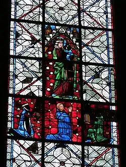 Photo d'un détail de la baie 27 figurant les donateurs du vitrail