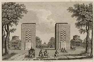 L'Arc de Triomphe inachevé entre les pavillons de la barrière de l'Étoile, 1818.