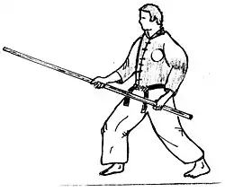 Travail avec bâton long.