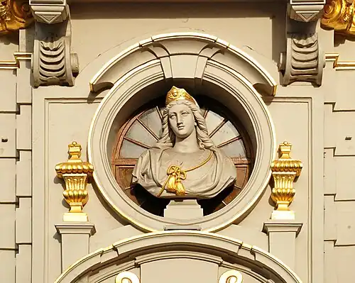Buste de sainte Barbe sur la façade de la Maison de la Chaloupe d'Or sur la Grand-Place de Bruxelles (Godefroid Van den Kerckhove, 1872).