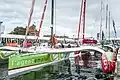 Le trimaran aux côtés des autres voiliers de la flotte sous le regard du public du village départ de la Route du Rhum