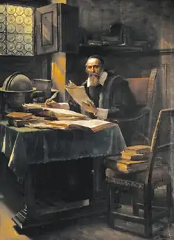 Peinture d'un homme assis au milieu de livres.