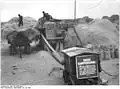 Battage avec un moteur électrique, Allemagne de l'Est, 1952.