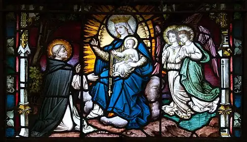 Saint Dominique reçoit le Rosaire de la Vierge Marie en 1214.