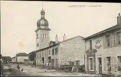 Carte postale ancienne de Paul Testart, montrant la Grande Rue de Darnieulles.