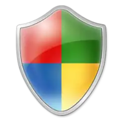 Logo en forme de bouclier rouge, vert, bleu et jaune de gauche à droite et de haut en bas.