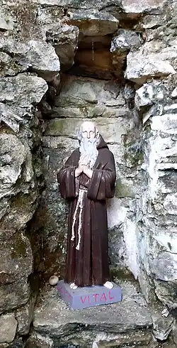 Saint Vital protégeant la fontaine.