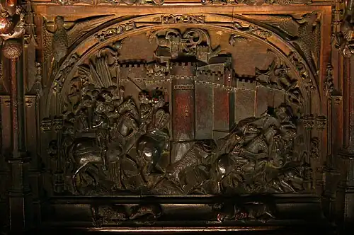Scène de la guerre de Grenade, stalle de la cathédrale de Tolède.