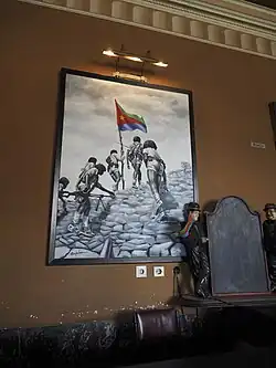 Photographie d'une affiche patriotique encadrée.