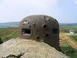 Cloche GFM de l'ouvrage de La Ferté, marquée par les impacts.