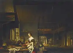 Intérieur de cuisine avec une femme cuisinant et un garçon soufflant sur les flammes