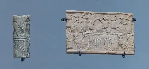 Sceau-cylindre avec son empreinte : scène de banquet sur deux registres.