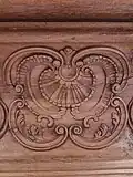 Détail d'une boiserie en forme de coquille Saint-Jacques