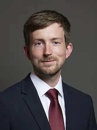 Dan Tomlinson (depuis 2024)