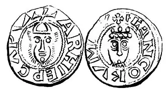 Dessin de l'avers et du revers d'une pièce de monnaie, avec sur chaque côté un visage au milieu, surmonté d'une petite croix et entouré de mots latins