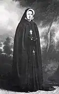 1923. Le jour de sa profession religieuse, le 15 août. Son nom en religion est  Marie Sainte-Cécile-de-Rome.
