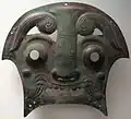 Plaque de char de guerre en forme de masque. Zhou occidentaux. Musée Guimet Paris