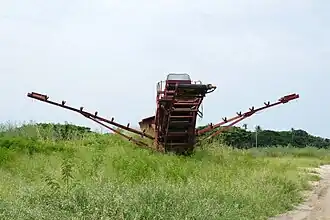 Ancienne machine à broyer la canne à sucre.