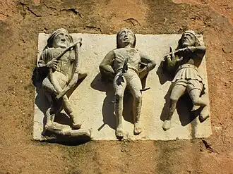 Détail de la porte de l'église : le martyre de saint Sébastien.