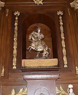 Groupe sculpté Saint-Martin et le pauvre en bois taillé polychrome du XVIIe siècle .