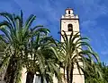 Église de la Mare de Déu del Roser de Benillup et les palmiers.