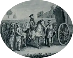 Cortège d’hommes enturbannés qui entourent un seul cavalier. Un carrosse les précède.