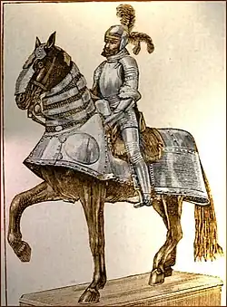 Statut d'un cheval bardé monté par un homme en armure.