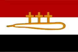 drapeau à trois bandes horizontales : rouge, blanc et noir ; dans le blanc une massue surmontée de trois croix